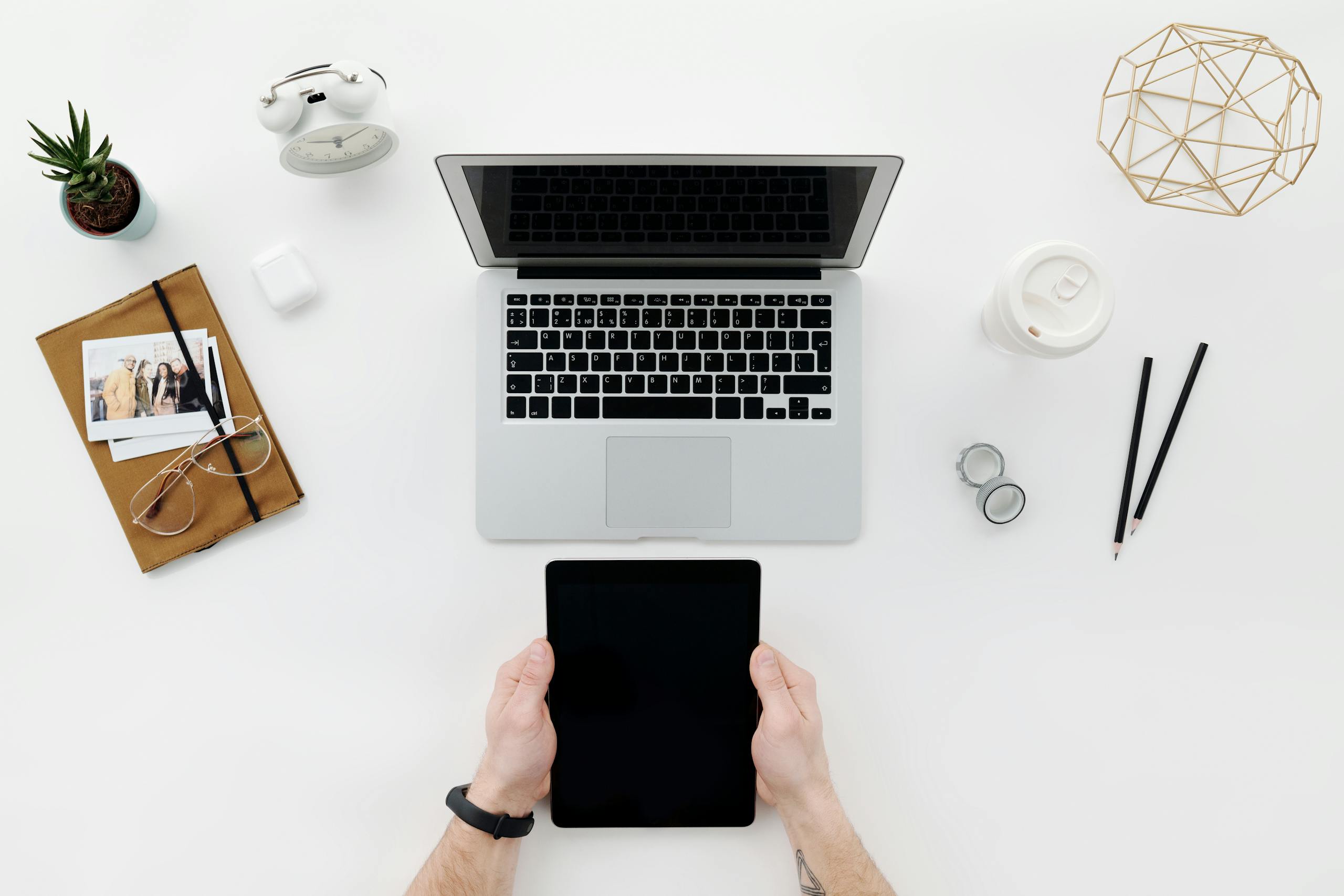 Person Holding Black Tablet Computer