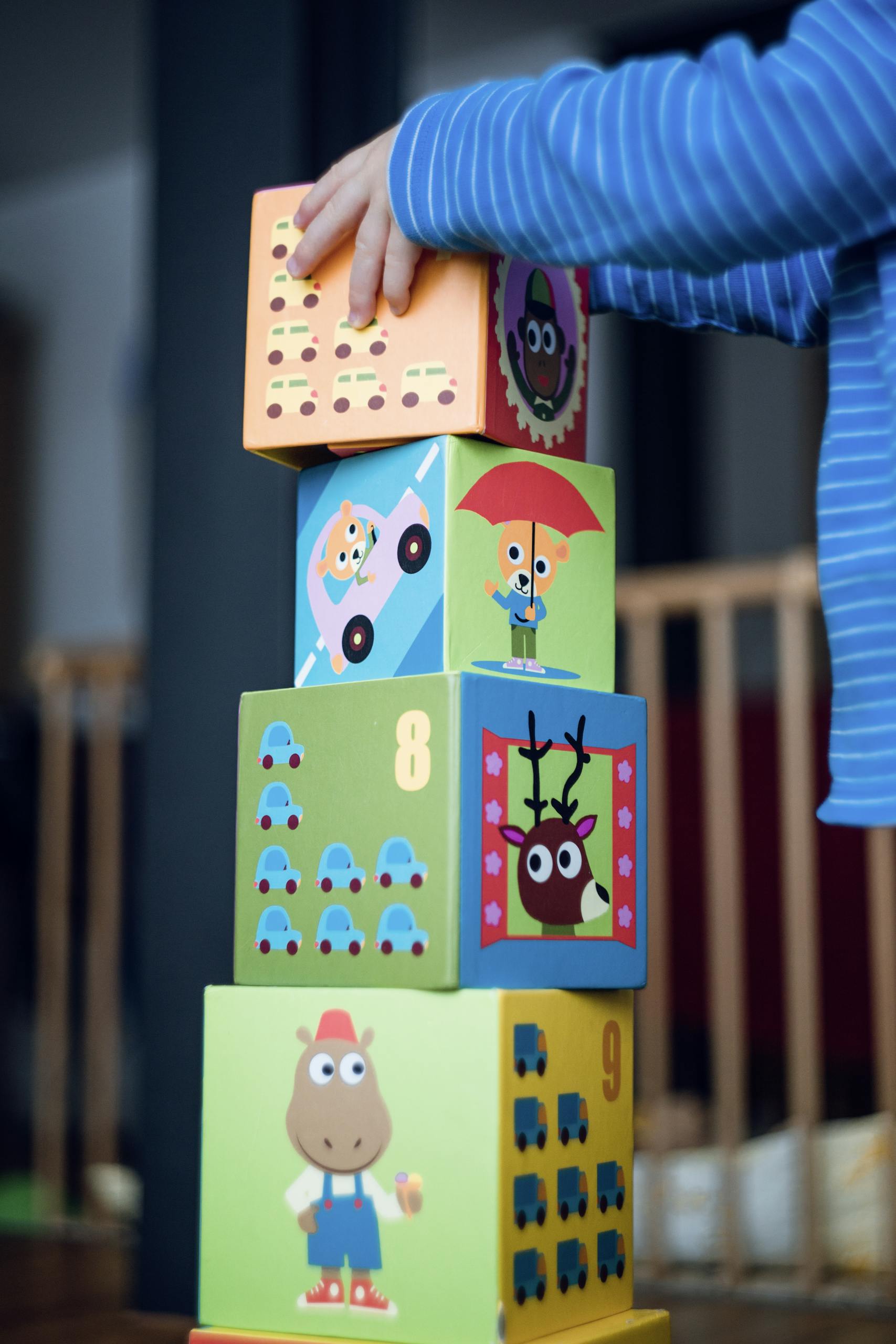 Person Holding Yellow and Pink Lego Blocks